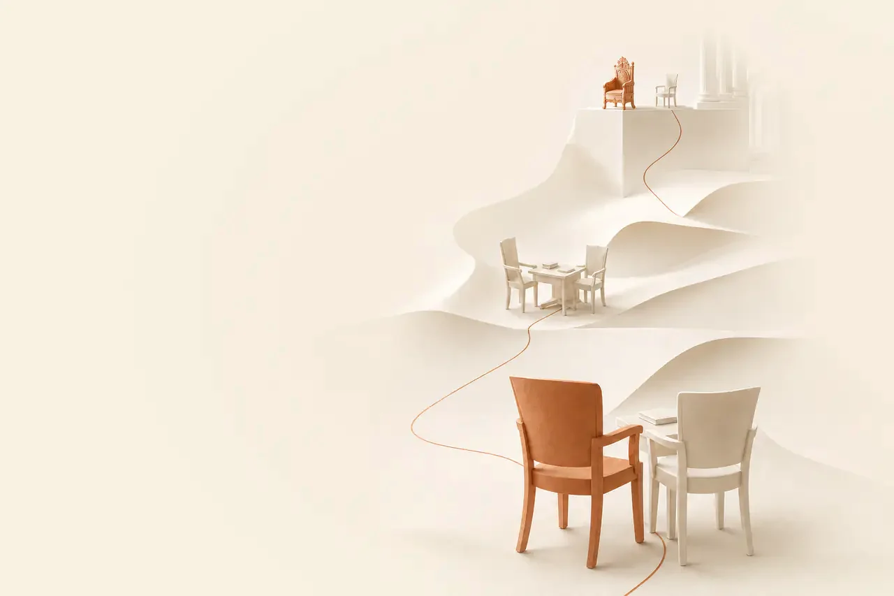 On hills of paper: a throne, a tutorial table, and two chairs side by side